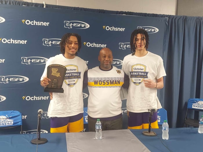 Wossman's Krystian Lewis (from left), coach Casey Jones and Jordan Comanche after the Wildcats claimed the Division II non-select title on March 8, 2024.